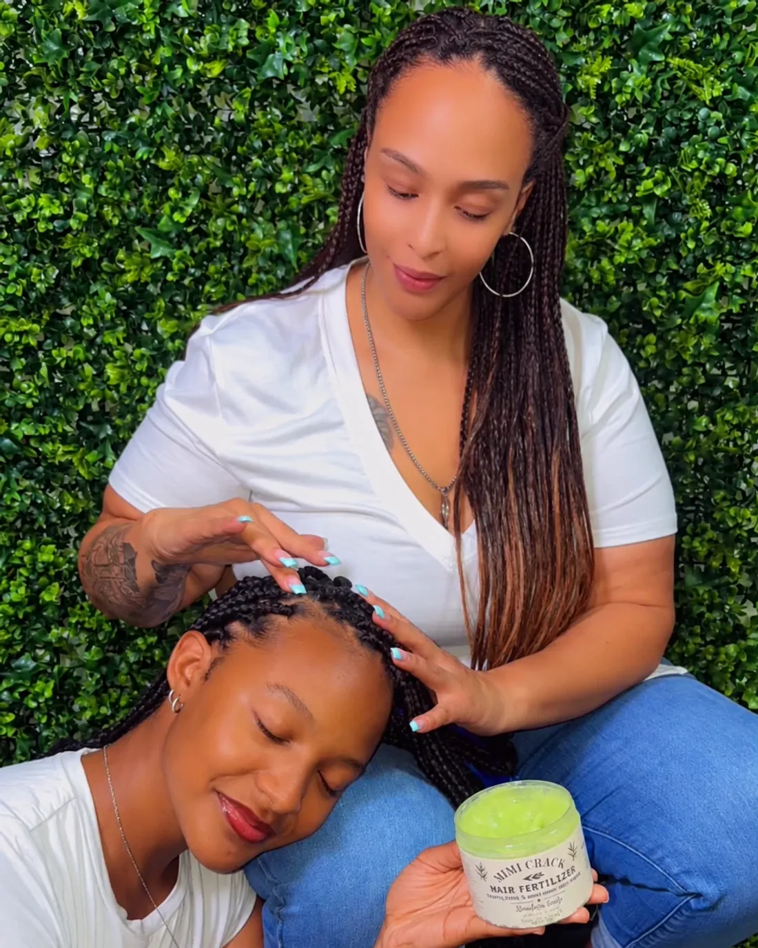 Braids greased along their length, the open jar in hand